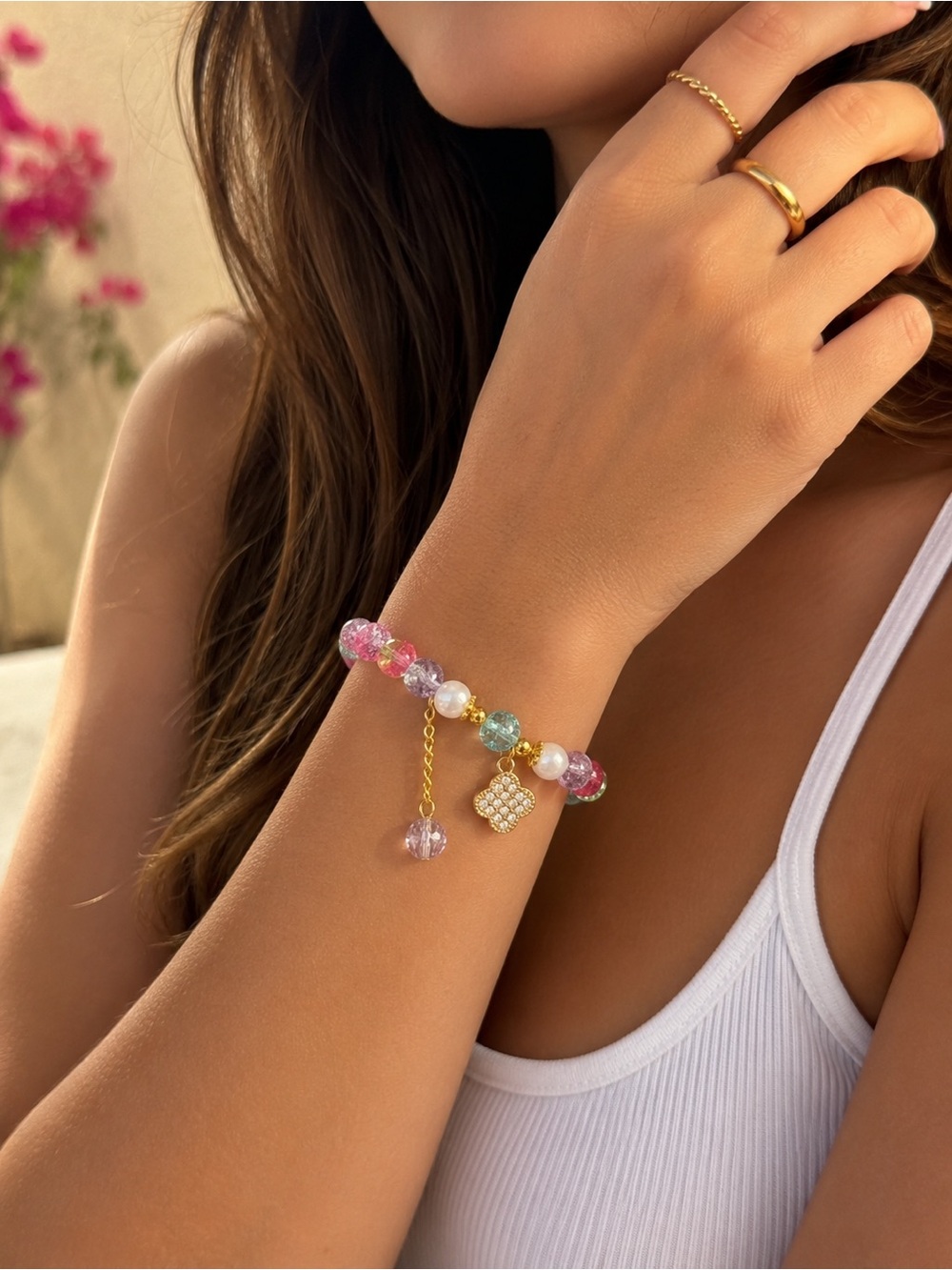 Multi colored bead bracelet with clover charm